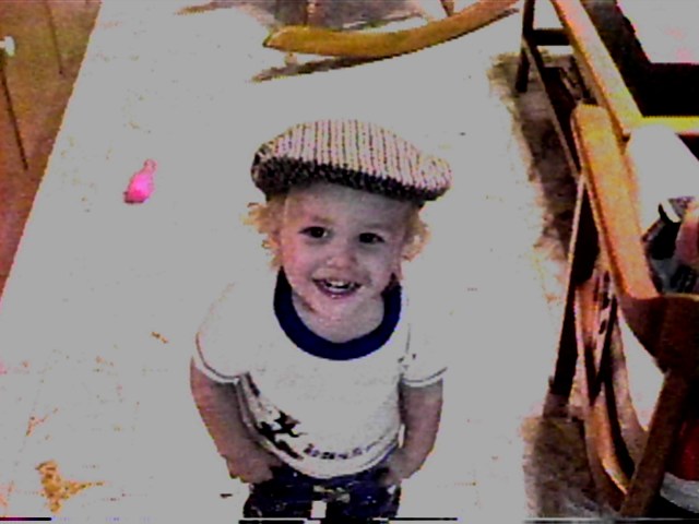 Ben in Dad's hat Dec 31st 1999.JPG (50761 bytes)